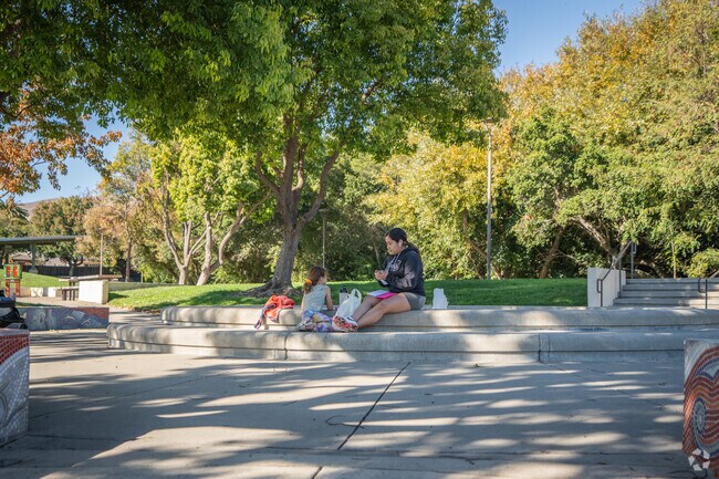 Residents eat lunch outside at Shannon Park.