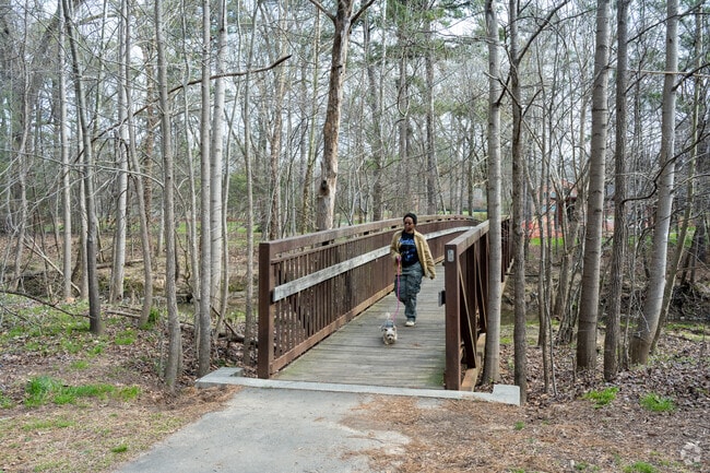 Walltown residents enjoy walking on the Ellerbee Creek Trail with their furry friends.