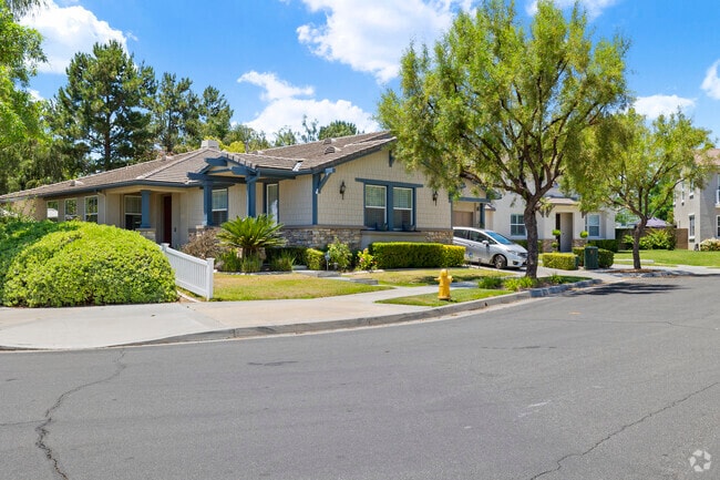 Residents enjoy strolling down the treelined streets in the Harveston neighborhood.