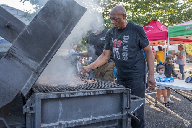 Residents cook up fresh food at Opelika's National Night Out in North Gate.