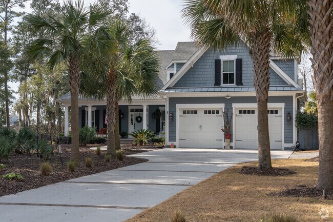 Homes on Cat Island feature large driveways and well-kept landscaping.