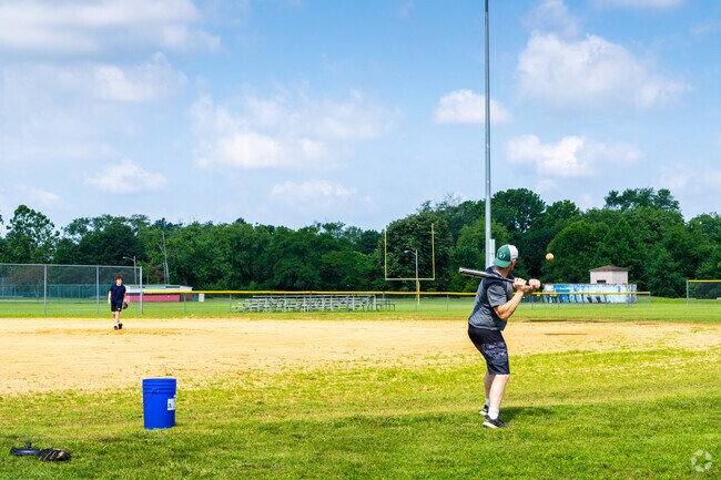 Practice fielding balls on the baseball diamonds at Iron Works Park.