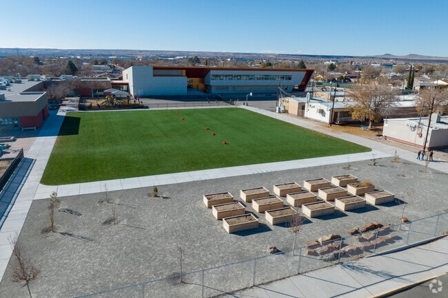 Grass field and garden beds at Lavaland Elementary School.