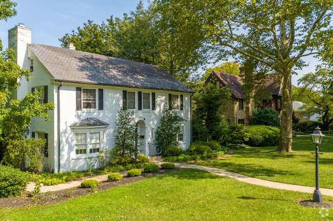 2 story colonial revivals stand next to gorgeous tudors in Violet Hill