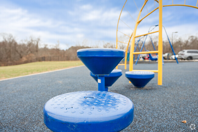 Students test their balance on the playground at East Elementary School in Hingham.