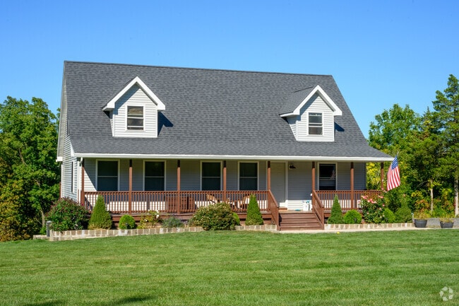 An unusual Cape Cod with a porch sits in Kingston.