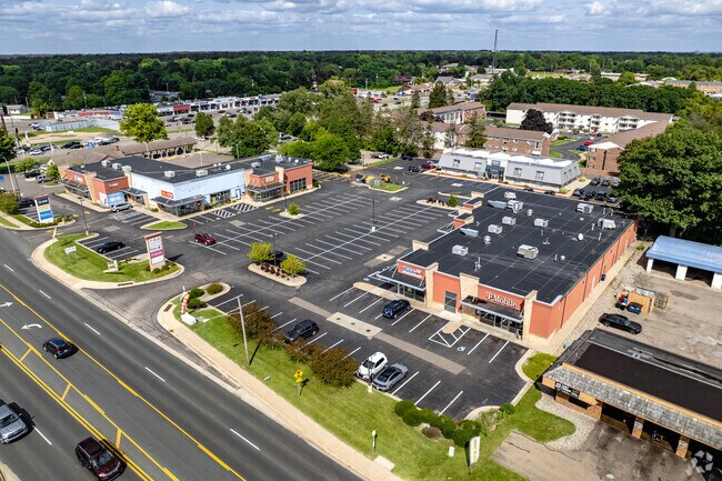 A shopping center featuring retail and restaurants is located near Arcadia on Drake Rd.