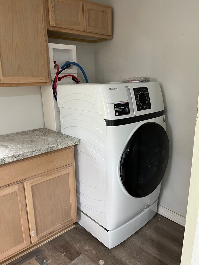 Brand new washer/dryer unit off of kitchen area