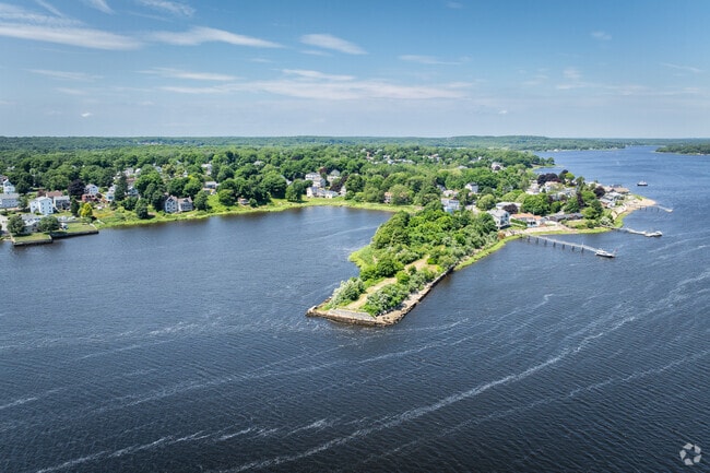 Capture the stunning aerial views of riverfront homes in picturesque Pottersville, MA.