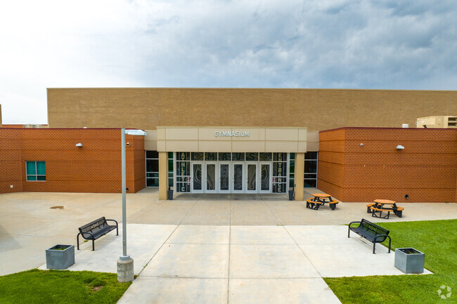 The outside of Maize South Middle School's gymnasium has several benches to enjoy.