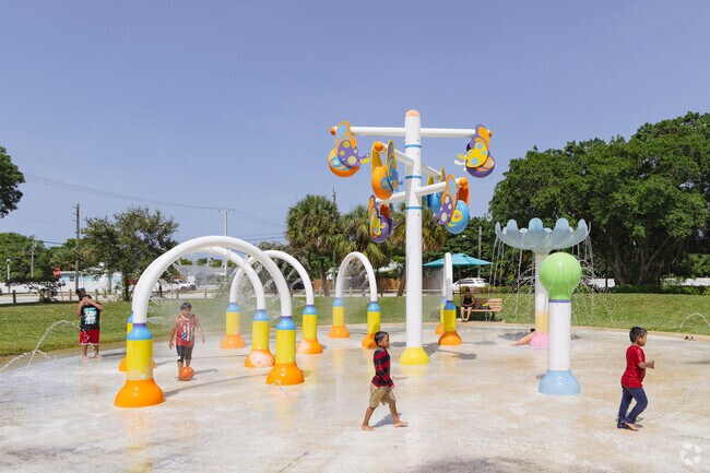 Prospect Heights kids enjoying the water features at Bill Moss Paseo park.