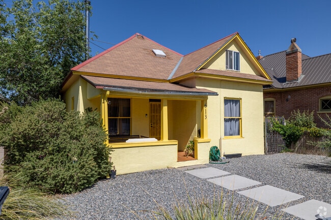 A sunny yellow bungalow stands out in Broadway Central Corridor’s historic Huning Highlands.