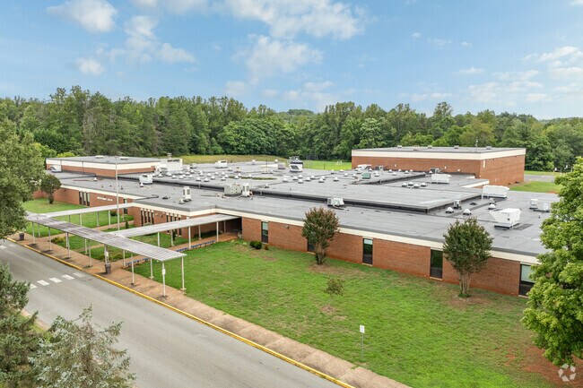 Teachers greet students with warm smiles at Leslie H. Walton Middle School.
