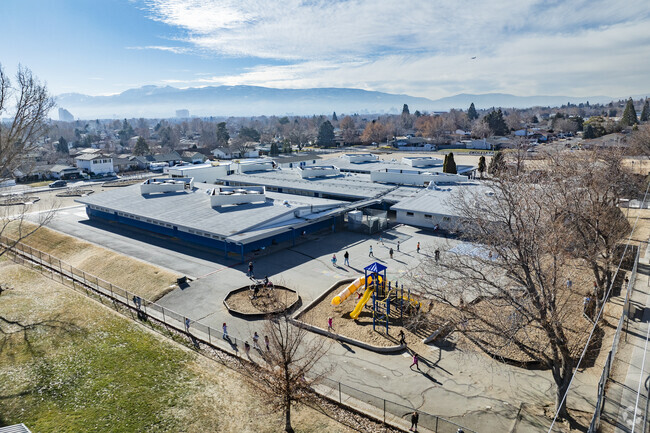 An aerial view of Lena Juniper Elementary School with Sparks in the background.