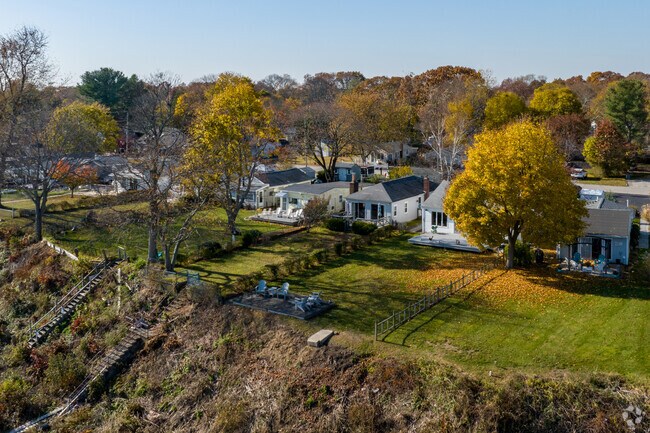 Riverfront properties sit atop a cliff, offering sunset views in Palace Garden.