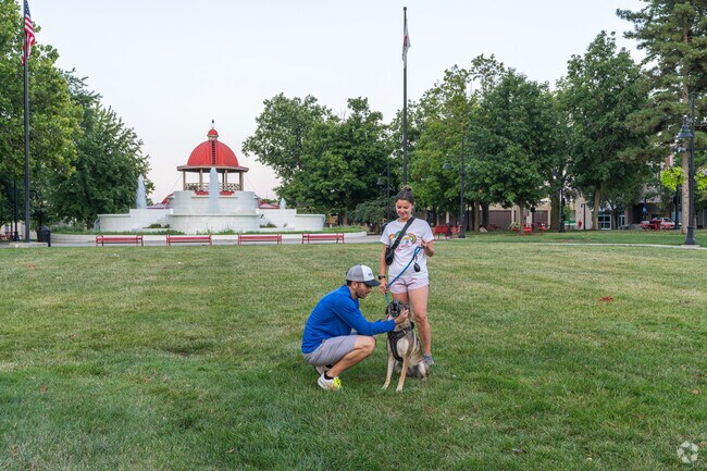 Dog owners appreciate the open field at Central Park, just a short drive from Wabash Crossing.