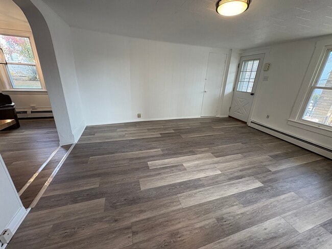 Socialist and bright living room with new flooring throughout