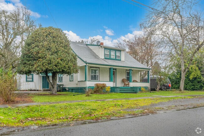 A classic Bungalow home with a charming front porch in Hubbard, OR.