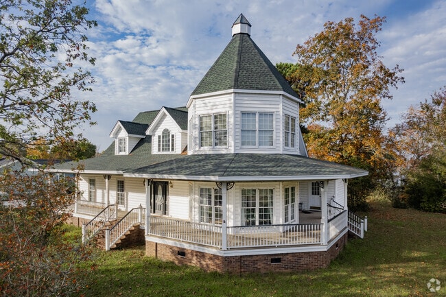 Find charming queen anne style homes with wrap around porches.