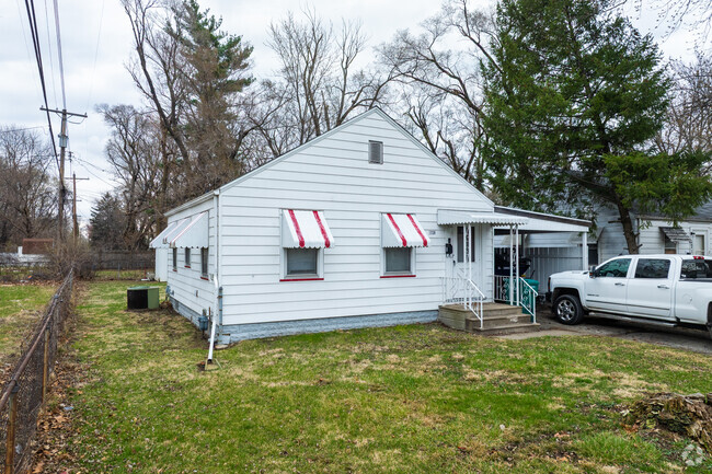 This home in Fans Field has unique red window awnings.