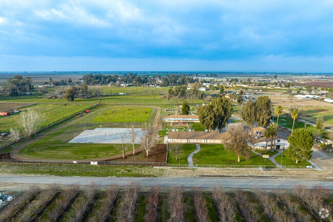 Gideon Apostolic Academy surrounded by farms and agriculture.