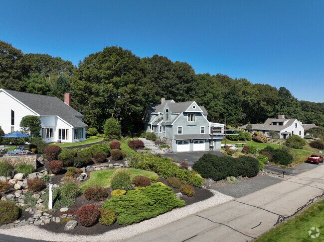 There are many custom homes surrounded by greenery in York Harbor.