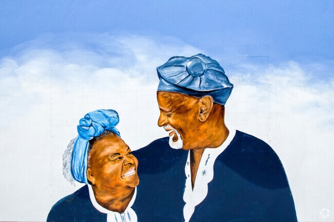 Vibrant mural painting of grandma and grandpa in the Near North neighborhood.