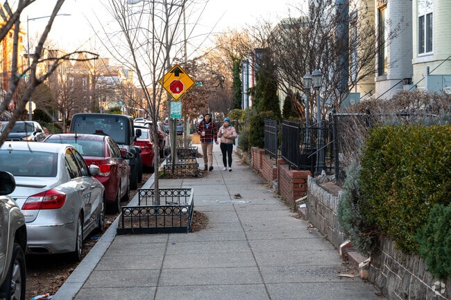 Locals enjoy a walk down the peaceful streets of the historic Bloomingdale neighborhood.
