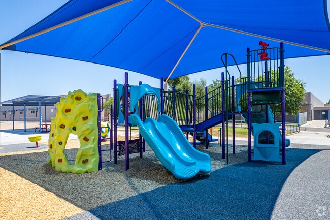 Children enjoy playtime on the vibrant playground of Sweetwater School in Phoenix.
