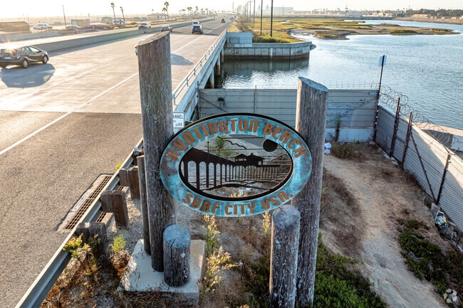 Travelers are greeted by the Huntington Beach sign as they cruise through Southeast on PCH.