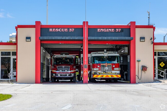 The Lantana Fire Station brigade often trains outside and cleans the fire trucks.