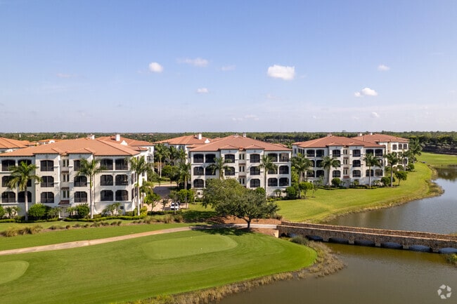 The golf course in Talis Park is partially lined with low-rise condos.