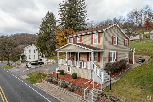 These colonial revival homes sits along a very hilly street in the migdle of Union.