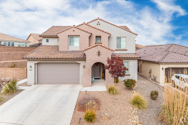 Two-story stucco homes line quiet residential streets in Volcano Cliffs.