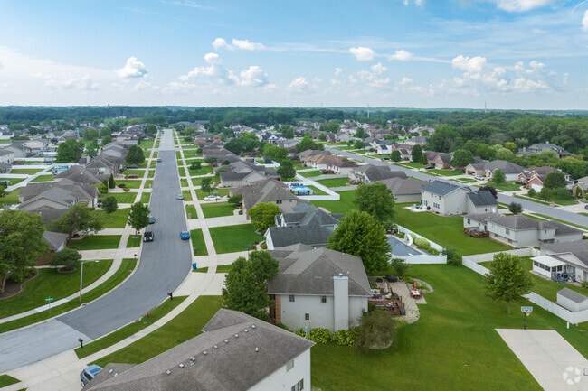 Aerial view of the rounding streets lined with trees of New Elliott, Schererville, IN.