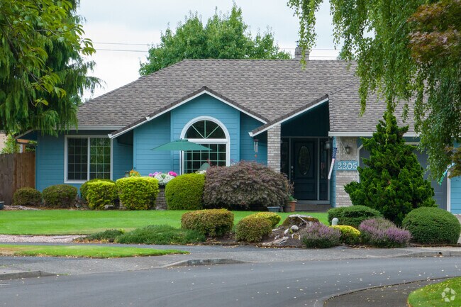 Many homes enjoy shade from hanging tree limbs in Cimarron.