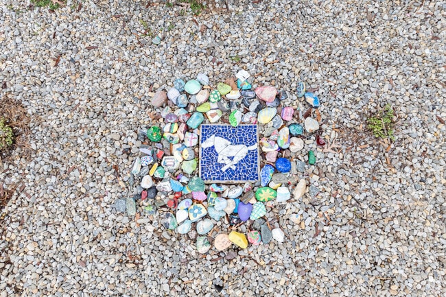 The Bakerfield Elementary students created a painted rock display around art of a Mustang.
