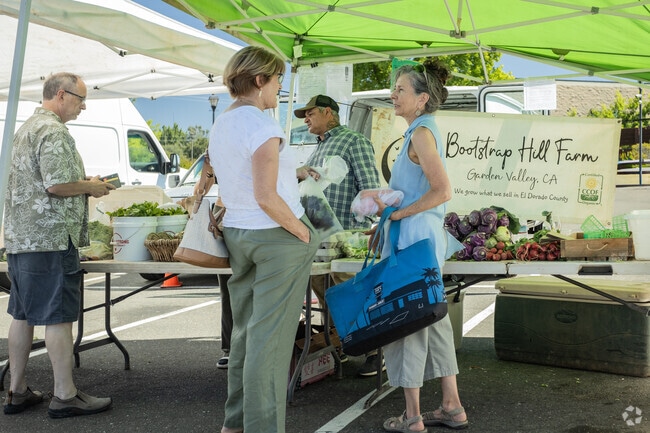 Friends meet at Cameron Park Certified Farmers’ Market.