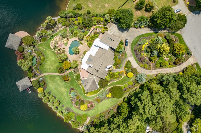 Large lake home with lush landscaping in the Lake Spivey neighborhood of Atlanta.