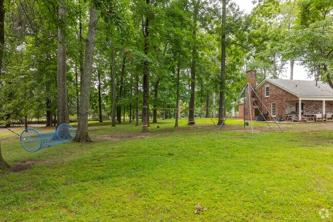 Faith Christian Academy features a playground in the woods.