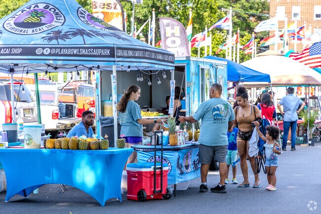 Visitors enjoy refreshing drinks at Perth Amboy's Independence Day Celebration near Hopelawn.