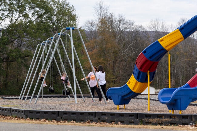 Children love to play on the playground and swings at Charles Stone Park in Gurley.