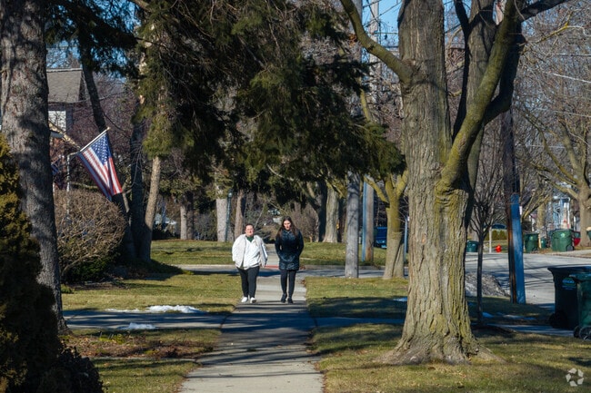 Residents enjoy a stroll through the neighborhood of Downtown Palatine.