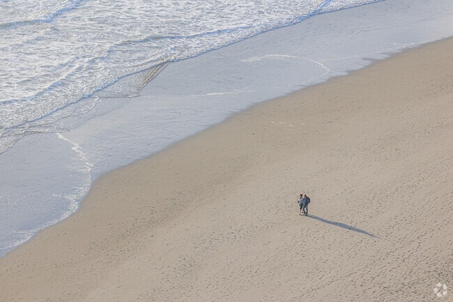 A couple finds solitude on the expansive sands of Stinson Beach.