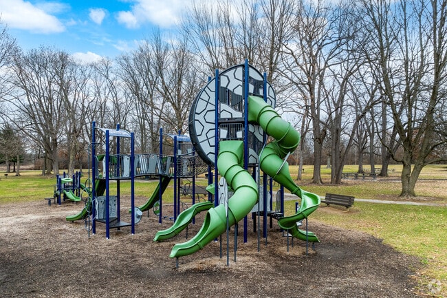Sharron Woods Park near Park Club features a playground for children.
