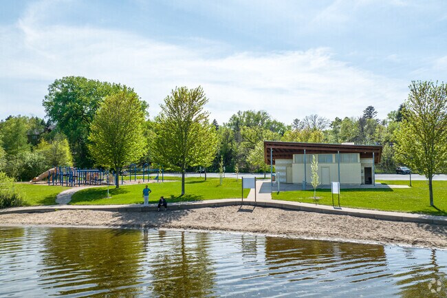The beach, picnic area and playground at Gervais County Park in Little Canada.