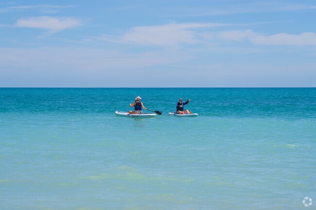 Paddleboard with friends in the Atlantic from the shores of Vero Beach.
