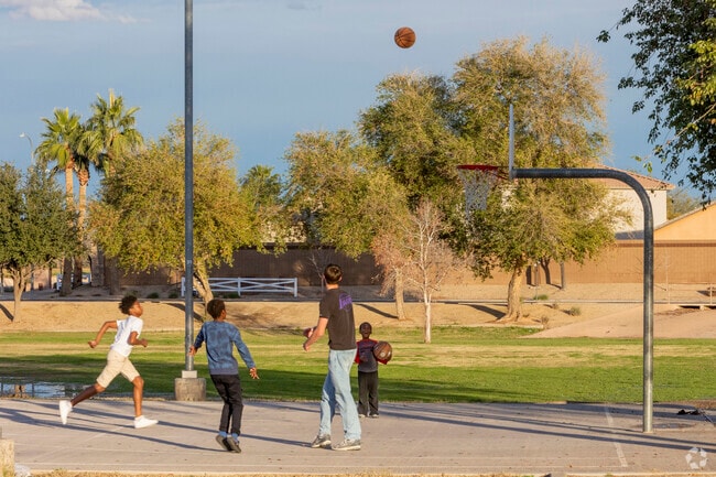 Kids play basketball at Laveen Village Park after school.