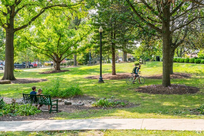 Park benches at Adams Park offer a quiet spot to unwind in Downtown Wheaton.