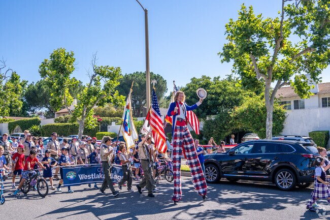 The 4th of July Parade isn't complete without the patriotic stilt walker.